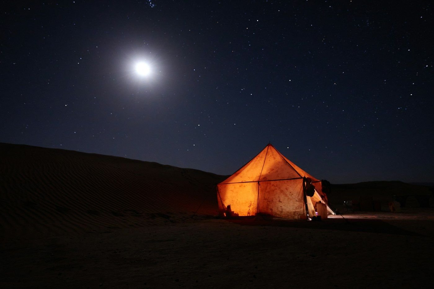 Desert bivouac at night in M’Hamid